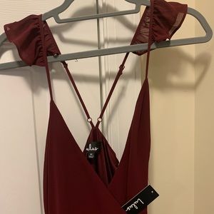 Lulu’s long burgundy dress with open leg and spaghetti straps.